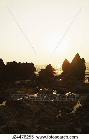Silhouette of rocks on the coast, Goa, India View Large Photo Image Stock Photography - Silhouette of rocks on the coast, Goa, India. Fotosearch