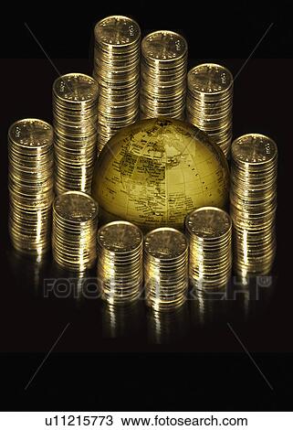 Stack of coins around a globe View Large Photo Image Stock Image - Stack of coins around a globe. Fotosearch