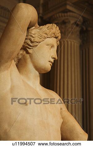 Stock Photo - Statue in a museum, Musee du Louvre, Paris, France. Fotosearch