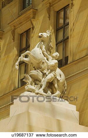 Statue in a museum, Musee du Louvre, Paris, France View Large Photo Image Stock Photo - Statue in a museum, Musee du Louvre, Paris, France. Fotosearch