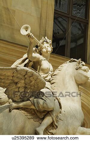 Statue in a museum, Musee du Louvre, Paris, France View Large Photo Image Stock Photo - Statue in a museum, Musee du Louvre, Paris, France. Fotosearch