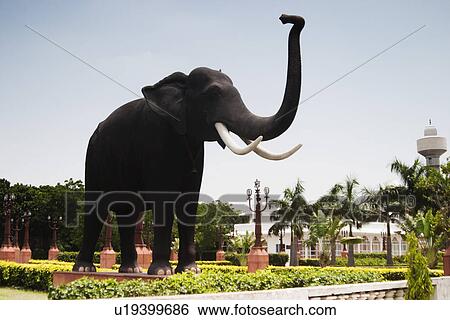 Stock Photograph - Statue of an elephant in a park, New Delhi, India. Fotosearch