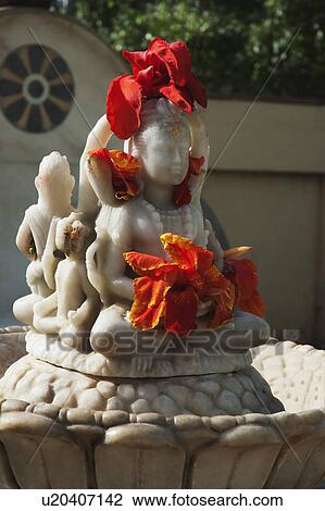 Stock Image - Statues in the garden of a temple, Lakshmi Narayan Temple, New Delhi, India. Fotosearch