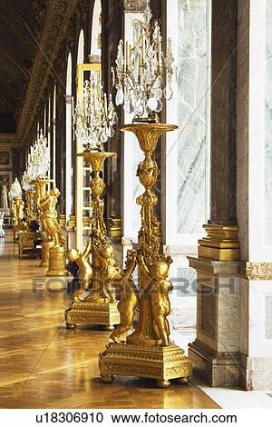 Statues with gilded lamps in a palace, Hall Of Mirrors, Chateau de Versailles, Versailles, Paris, France View Large Photo Image Stock Image - Statues with gilded lamps in a palace, Hall Of Mirrors, Chateau de Versailles, Versailles, Paris, France. Fotosearch