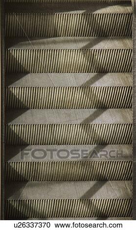 Stock Image - Steps of an escalator, Paris, France. Fotosearch
