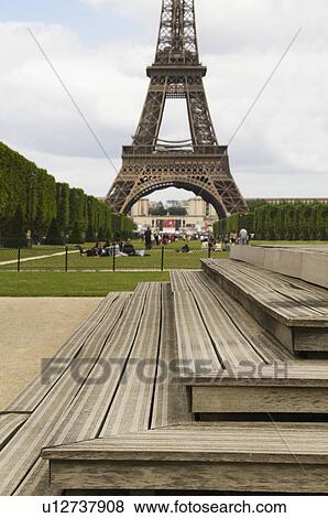 Steps with a tower in the background, Eiffel Tower, Champ De Mars, Paris, France View Large Photo Image Stock Photo - Steps with a tower in the background, Eiffel Tower, Champ De Mars, Paris, France. Fotosearch