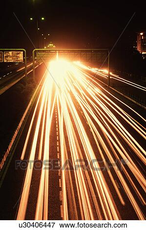 Stock Photo - Streaks of headlights of moving vehicles on the road, National Highway 8, Gurgaon, Haryana, India. Fotosearch