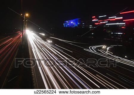 Streaks of lights of moving vehicles on the road, National Highway 8, Gurgaon, Haryana, India View Large Photo Image Picture - Streaks of lights of moving vehicles on the road, National Highway 8, Gurgaon, Haryana, India. Fotosearch