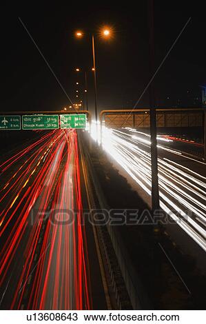 Streaks of lights of moving vehicles on the road, National Highway 8, Gurgaon, Haryana, India View Large Photo Image Stock Image - Streaks of lights of moving vehicles on the road, National Highway 8, Gurgaon, Haryana, India. Fotosearch