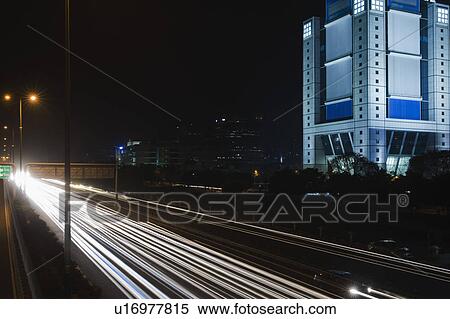 Stock Photography - Streaks of lights of moving vehicles on the road, National Highway 8, Gurgaon, Haryana, India. Fotosearch