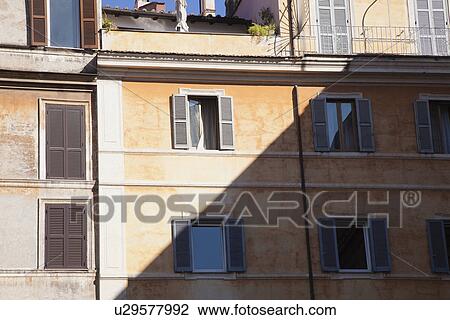 Stock Image - Sunlight falling on a building, Piazza di Santa Maria in Trastevere, Rome, Lazio, Italy. Fotosearch
