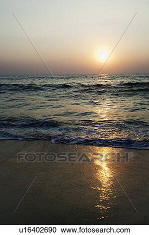 Sunset over the beach, Goa, India View Large Photo Image Stock Image - Sunset over the beach, Goa, India. Fotosearch