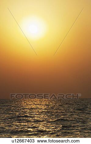 Sunset over the sea, Goa, India View Large Photo Image Stock Image - Sunset over the sea, Goa, India. Fotosearch