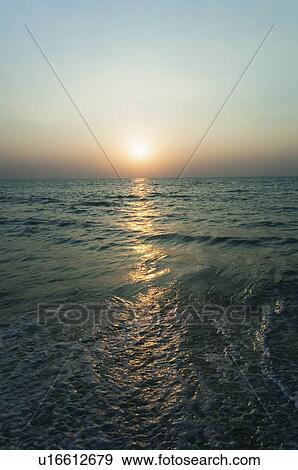 Stock Photo - Sunset over the sea, Goa, India. Fotosearch