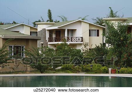 Stock Image - Swimming pool in front of tourist resorts, Jim Corbett National Park, Nainital, Uttarakhand, India. Fotosearch