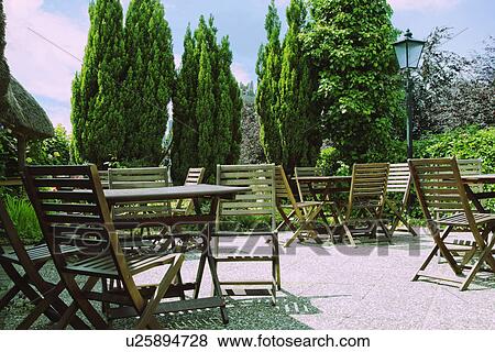 Tables and chairs in a restaurant, Adare, County Limerick, Republic of Ireland View Large Photo Image Stock Photo - Tables and chairs in a restaurant, Adare, County Limerick, Republic of Ireland. Fotosearch