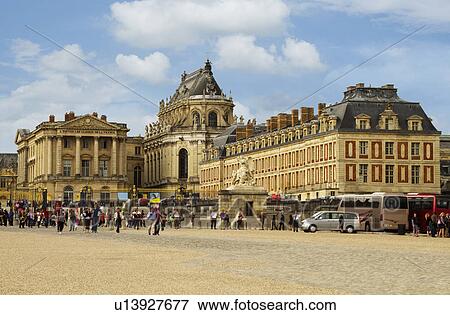 Stock Photo - Tourists in front of a palace, Chateau de Versailles, Versailles, Paris, France. Fotosearch