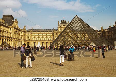 Tourists near a pyramid, Louvre Pyramid, Musee du Louvre, Paris, France View Large Photo Image Stock Photo - Tourists near a pyramid, Louvre Pyramid, Musee du Louvre, Paris, France. Fotosearch