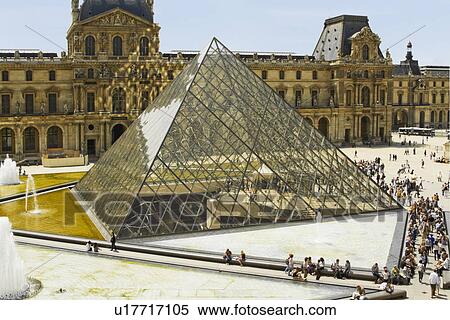 Stock Photography - Tourists near a pyramid, Louvre Pyramid, Musee du Louvre, Paris, France. Fotosearch