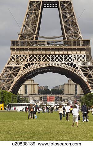 Stock Photo - Tourists near a tower, Eiffel Tower, Paris, France. Fotosearch