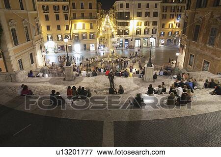 Stock Photo - Tourists sitting on Spanish Steps, Piazza Di Spagna, Rome, Lazio, Italy. Fotosearch