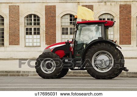 Tractor in front of a building, Paris, France View Large Photo Image Stock Image - Tractor in front of a building, Paris, France. Fotosearch