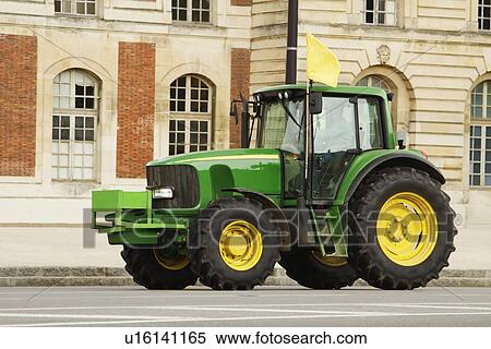 Tractor in front of a building, Paris, France View Large Photo Image Stock Photography - Tractor in front of a building, Paris, France. Fotosearch