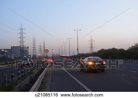 Traffic on a highway at dusk, National Highway 8, Gurgaon, Haryana, India View Large Photo Image Stock Photograph - Traffic on a highway at dusk, National Highway 8, Gurgaon, Haryana, India. Fotosearch