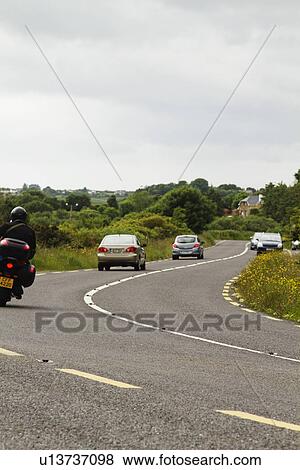 Traffic on a road, Ring Of Kerry, County Kerry, Republic of Ireland View Large Photo Image Stock Photo - Traffic on a road, Ring Of Kerry, County Kerry, Republic of Ireland. Fotosearch