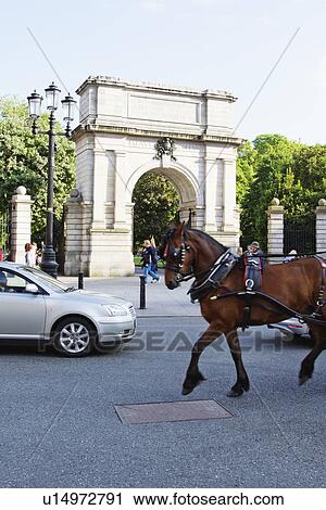 Traffic with an arch at entrance of a public park, Fusiliers arch, St Stephen's Green, Dublin, Republic of Ireland View Large Photo Image Stock Image - Traffic with an arch at entrance of a public park, Fusiliers arch, St Stephen's Green, Dublin, Republic of Ireland. Fotosearch