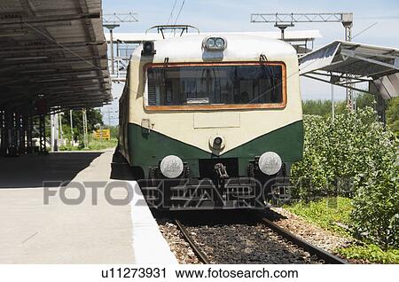 Stock Image - Train at a railroad station, Kanchipuram, Tamil Nadu, India. Fotosearch