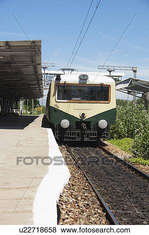 Stock Photo - Train at a railroad station, Kanchipuram, Tamil Nadu, India. Fotosearch