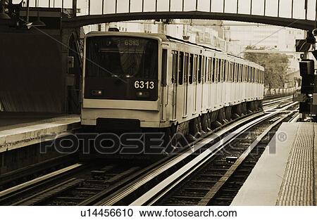Stock Image - Train at a station, Paris, France. Fotosearch