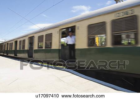 Train on railroad tracks, Kanchipuram, Tamil Nadu, India View Large Photo Image Stock Image - Train on railroad tracks, Kanchipuram, Tamil Nadu, India. Fotosearch