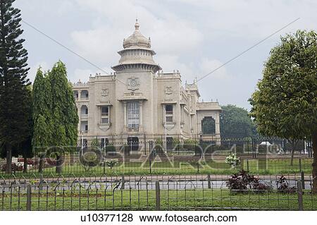 Stock Photo - Trees in front of a government building, Vidhana Soudha, Bangalore, Karnataka, India. Fotosearch