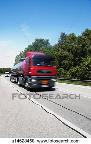 Stock Photo - Truck moving on the road, Cesky Krumlov, South Bohemian Region, Czech Republic. Fotosearch