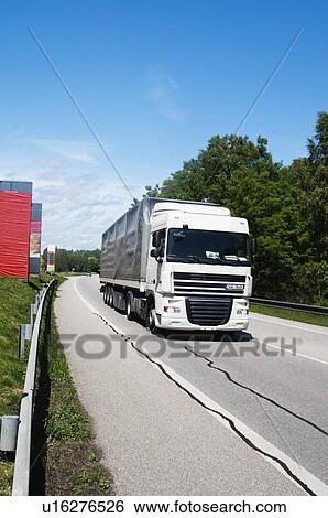 Truck moving on the road, Cesky Krumlov, South Bohemian Region, Czech Republic View Large Photo Image Stock Photograph - Truck moving on the road, Cesky Krumlov, South Bohemian Region, Czech Republic. Fotosearch