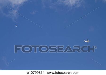 Two airplanes in the sky, Paris, France View Large Photo Image Picture - Two airplanes in the sky, Paris, France. Fotosearch