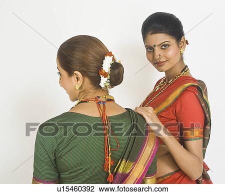 Two female folk dancers standing together in traditional Maharashtrian dress View Large Photo Image Stock Image - Two female folk dancers standing together in traditional Maharashtrian dress. Fotosearch