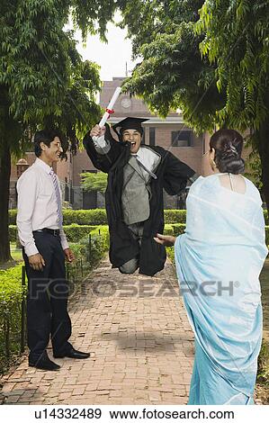 University student celebrating after getting his diploma View Large Photo Image Stock Photo - University student celebrating after getting his diploma. Fotosearch