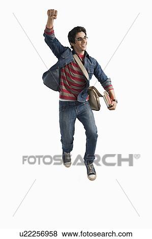 Stock Photo - University student jumping in excitement. Fotosearch
