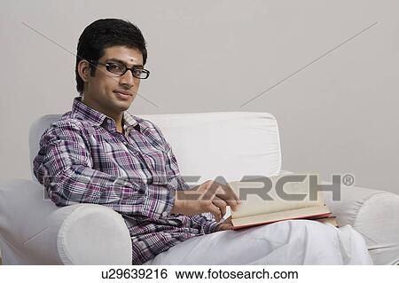 University student reading a book View Large Photo Image Stock Photograph - University student reading a book. Fotosearch