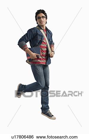 Stock Photograph - University student running with books and bag. Fotosearch