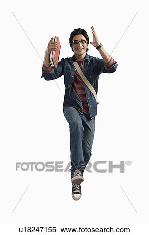 Stock Photography - University student running with books and bag. Fotosearch