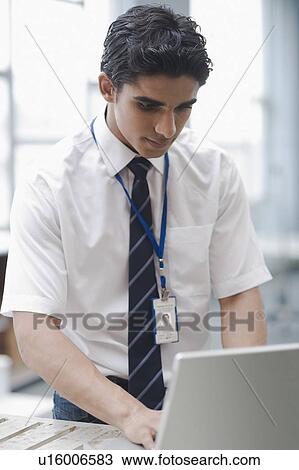 University student working on a laptop View Large Photo Image Stock Image - University student working on a laptop. Fotosearch