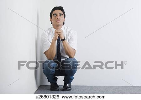 Upset university student in the corner View Large Photo Image Stock Photograph - Upset university student in the corner. Fotosearch