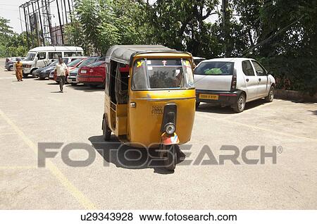 Vehicles parked at the roadside, Kanchipuram, Tamil Nadu, India View Large Photo Image Stock Photo - Vehicles parked at the roadside, Kanchipuram, Tamil Nadu, India. Fotosearch