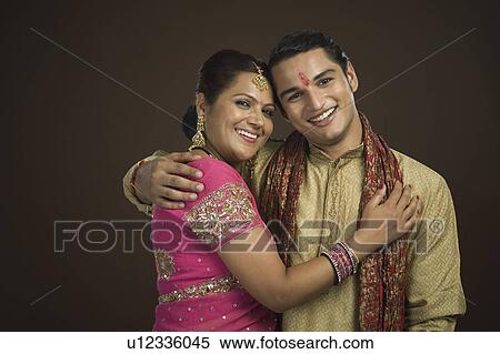 Woman and her son hugging each other View Large Photo Image Stock Photography - Woman and her son hugging each other. Fotosearch