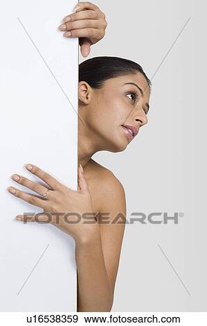 Woman behind the door View Large Photo Image Stock Photo - Woman behind the door. Fotosearch
