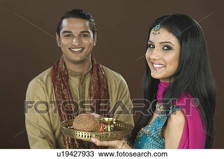 Woman doing aarti of her brother at the festival of Rakhi View Large Photo Image Stock Image - Woman doing aarti of her brother at the festival of Rakhi. Fotosearch